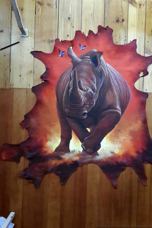 Storming Rhino on leather