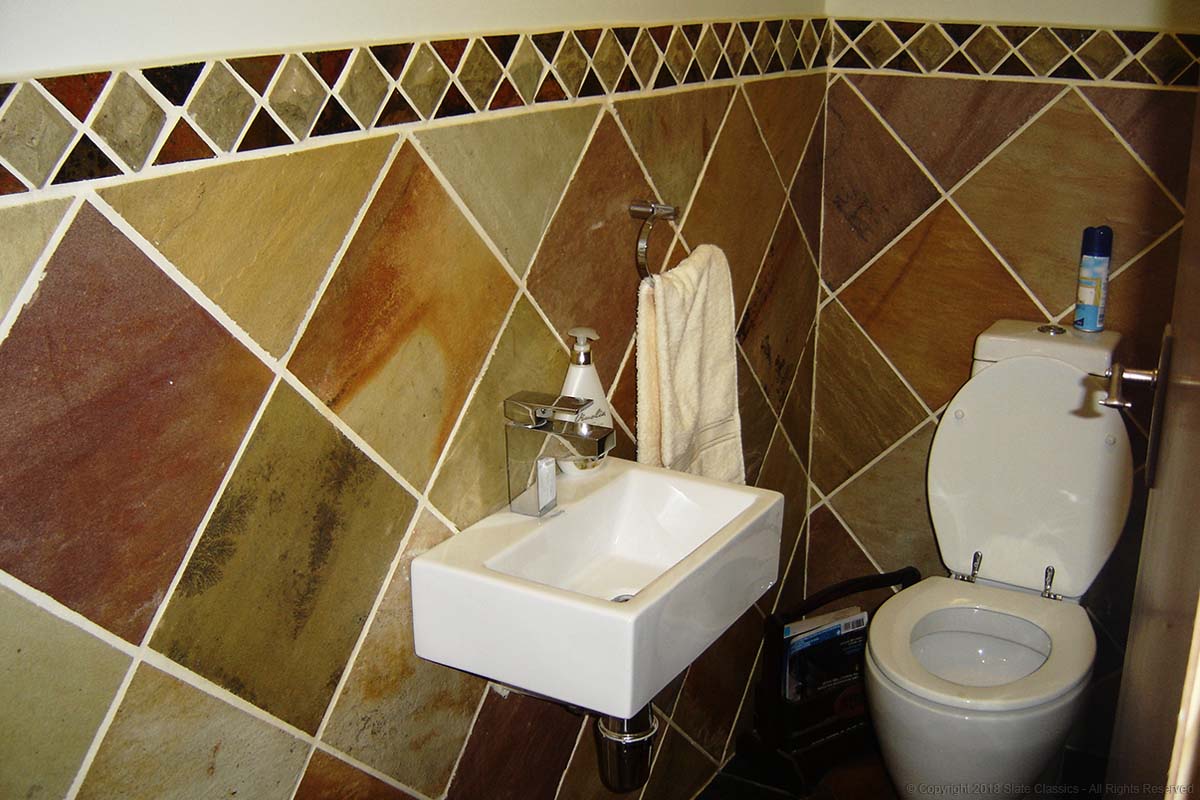 Sandstone & mosaic tiles in a Loo