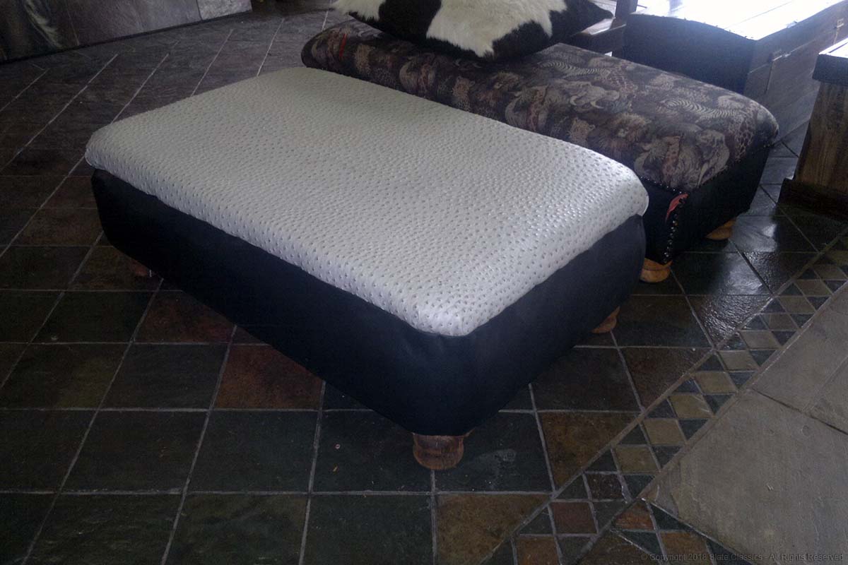 Leather clad ottoman
